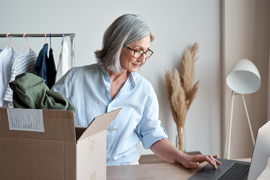 Entrepreneur in thoughtful contemplation, weighing the emotional and rational considerations of selling their business.