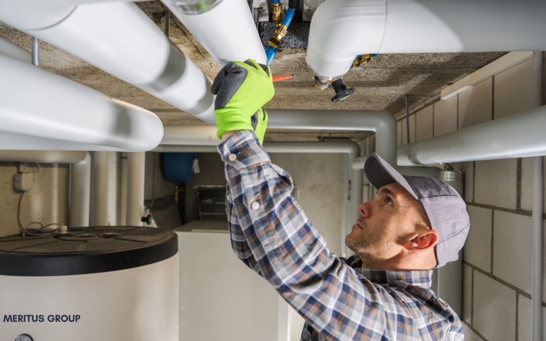 A businessman shaking hands with a buyer in an HVAC showroom